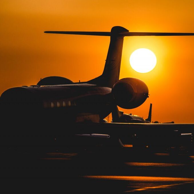 Plane with sunset in background