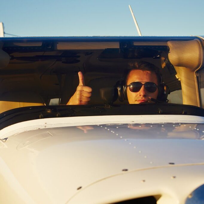 Young pilot is preparing for take off with private plane