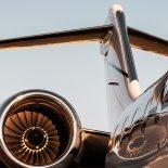 Plane side view with sunlight reflections