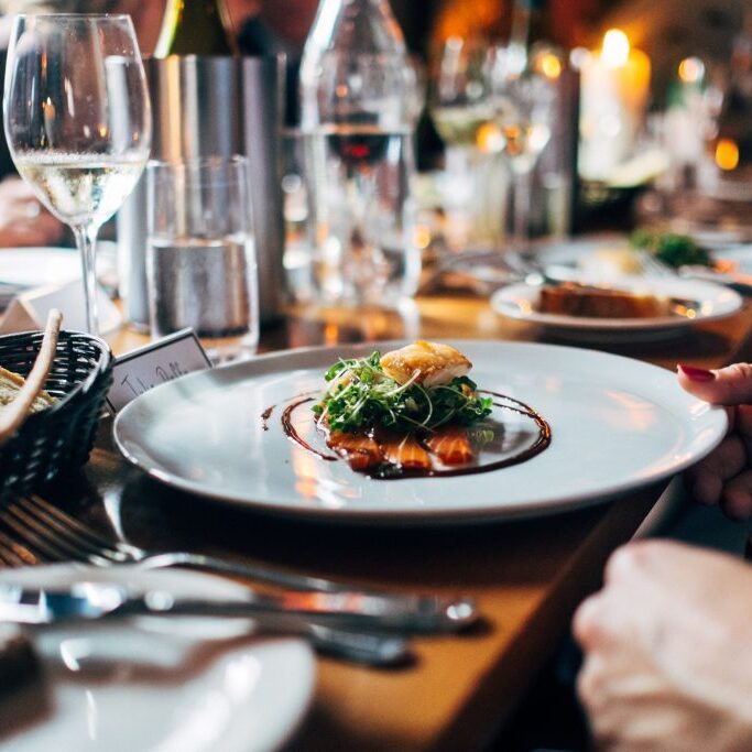 dinner table with plate of salmon salad